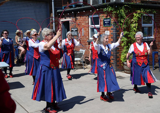 9 Butterfly Dancers in a set in the Brewery yard