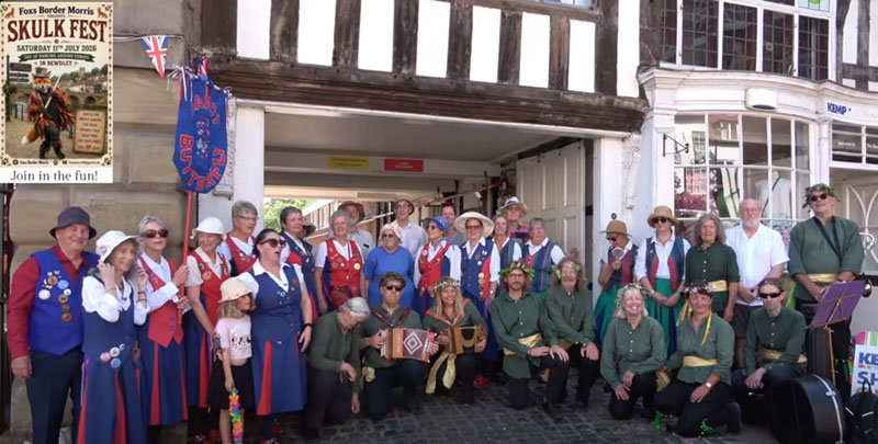 group photo of all participants at the Stanley Baldwin statue dance site