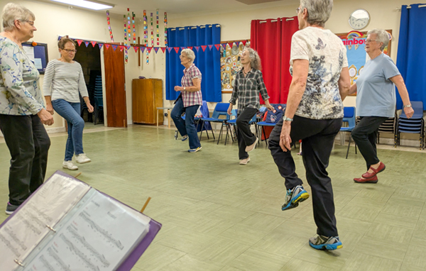 dancing on a sunny day in Upton with large crowd watching
